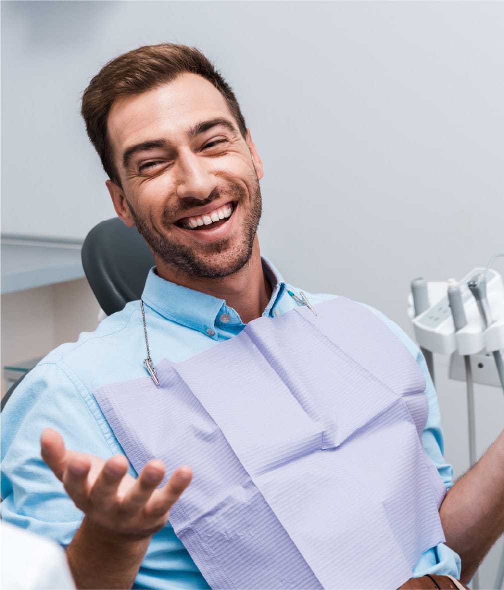 Smiling man at dentist clinic in London, comfortable dental visit at Attelia London.