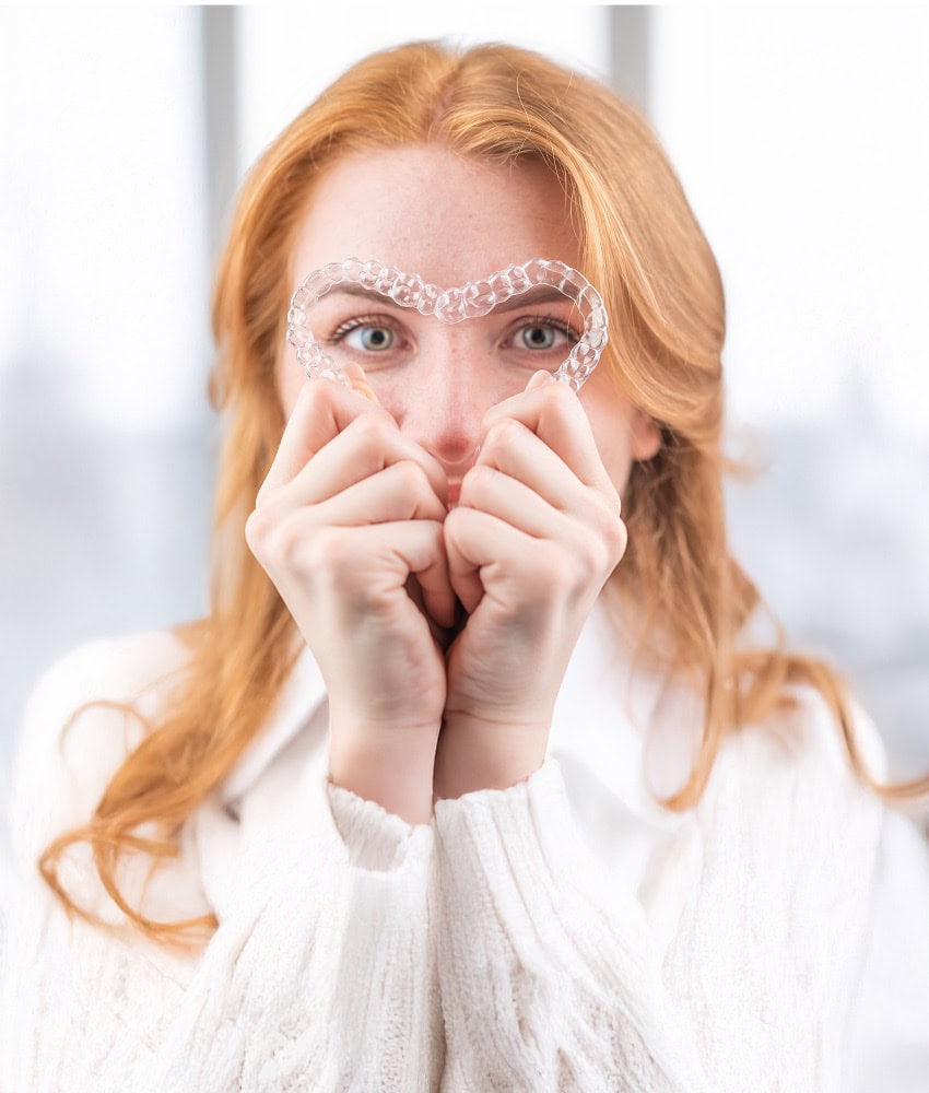 Heart-shaped clear aligner dental retainer for teeth straightening in London.
